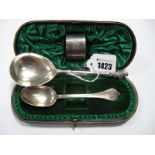 A Hallmarked Silver Christening Set, comprising spoon and napkin ring, initialled, in original