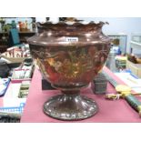 An Arts & Crafts Copper Pedestal Planter, with wavy rim, embossed foliage and heart shaped panels to