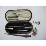 A Hallmarked Silver Handled Button Hook, mother or pearl handled implements, a sovereign case (