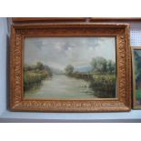 An Early XX Century Oil on Canvas, of a river scene with bridge and two men fishing, unsigned.