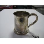 A Hallmarked Silver Mug, TB & S, Sheffield 1910, of plain tankard form, initialled, 8cm high.