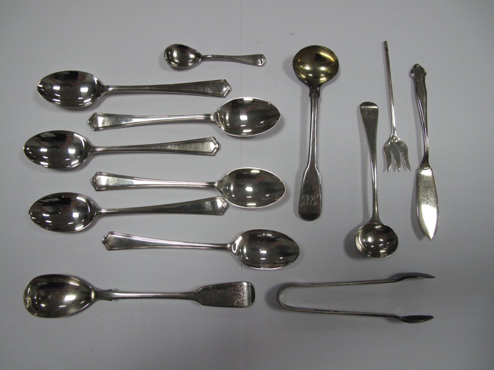 A Set of Six Hallmarked Silver Coffee Spoons, together with a pair of sugar tongs, condiment
