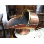 An Early XX Century Copper Coal Scuttle, with applied brass handle.