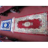Two Chinese Wool Rugs, with floral decoration on blue and red grounds, the smallest 124 x 67cm.