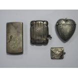 A Hallmarked Silver Vesta Case, engine turned; together with a heart shape vesta case, a lighter and