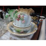 Early XX Century Wash Jug, Bowl and Chamber Pot, all with rose decoration on a blush ivory ground.