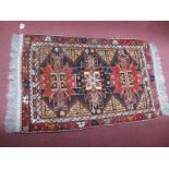 A XX Century Persian Style Wool Rug, with a geometric decoration tassel ends.