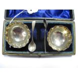 A Pair of Victorian Hallmarked Silver Salts, each with wavy rim, raised on three ball feet, in