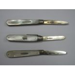 Three Hallmarked Silver and Mother of Pearl Folding Fruit Knives, the scales with inset detail,