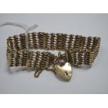 A 9ct Gold Gate Link Style Bracelet, to heart shape padlock clasp.