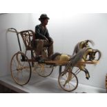 A Modern Replica of a Victorian Style Child's Push Along 'Trotting Cart', comprising two trotting
