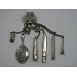 A Six Chain Chatelaine, suspending a hallmarked silver backed miniature hand mirror, cheroot case