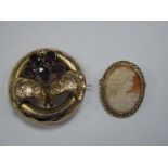 A XIX Century Brooch, oval collet set, together with a modern oval shell carved cameo brooch/