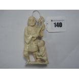 A Late XIX Century Ivory Carved Figure Group of Elder and Crouched Young Boy, signed under base