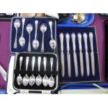 A Set of Six Hallmarked Silver Coffee Spoons, in a fitted case; together with a set of plated