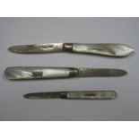 Three Hallmarked Silver and Mother of Pearl Folding Fruit Knives, the scales with inset detail. (3)