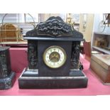 A XIX Century Black Slate Mantel Clock, of architectural form, shaped arched pediment with applied
