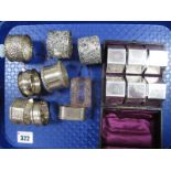 A Decorative Set of Plated Napkin Rings, in original fitted case; together with six assorted