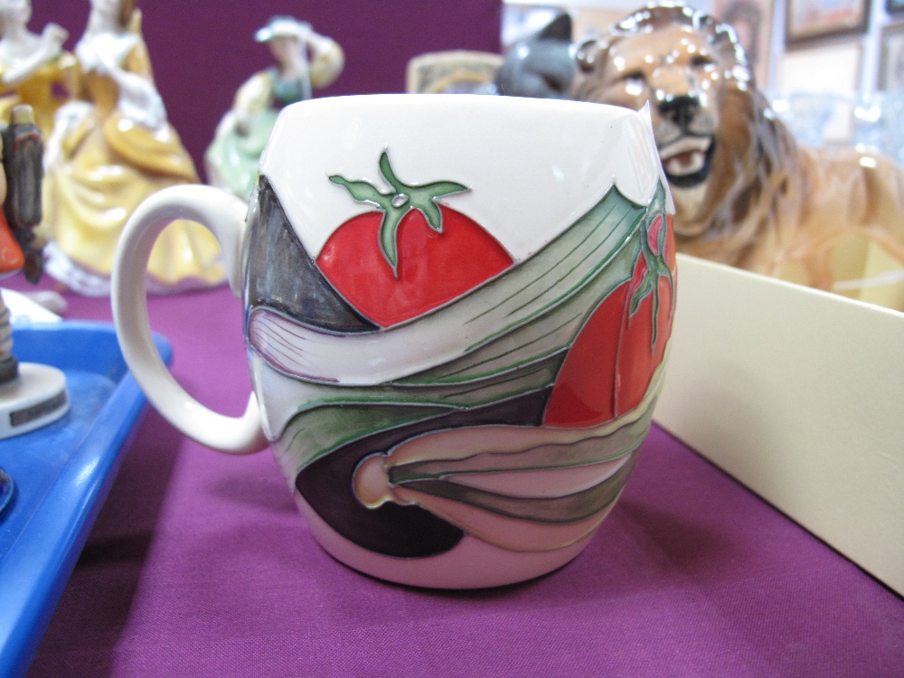 A Moorcroft Pottery Barrel Mug, painted in the 'Grow Your Own' pattern, designed by Kerry Goodwin,