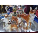 Royal Doulton Corgis, HN 2558 and HN 2559, St Bernard (lying) K19 and Cat HN 2582. (4)