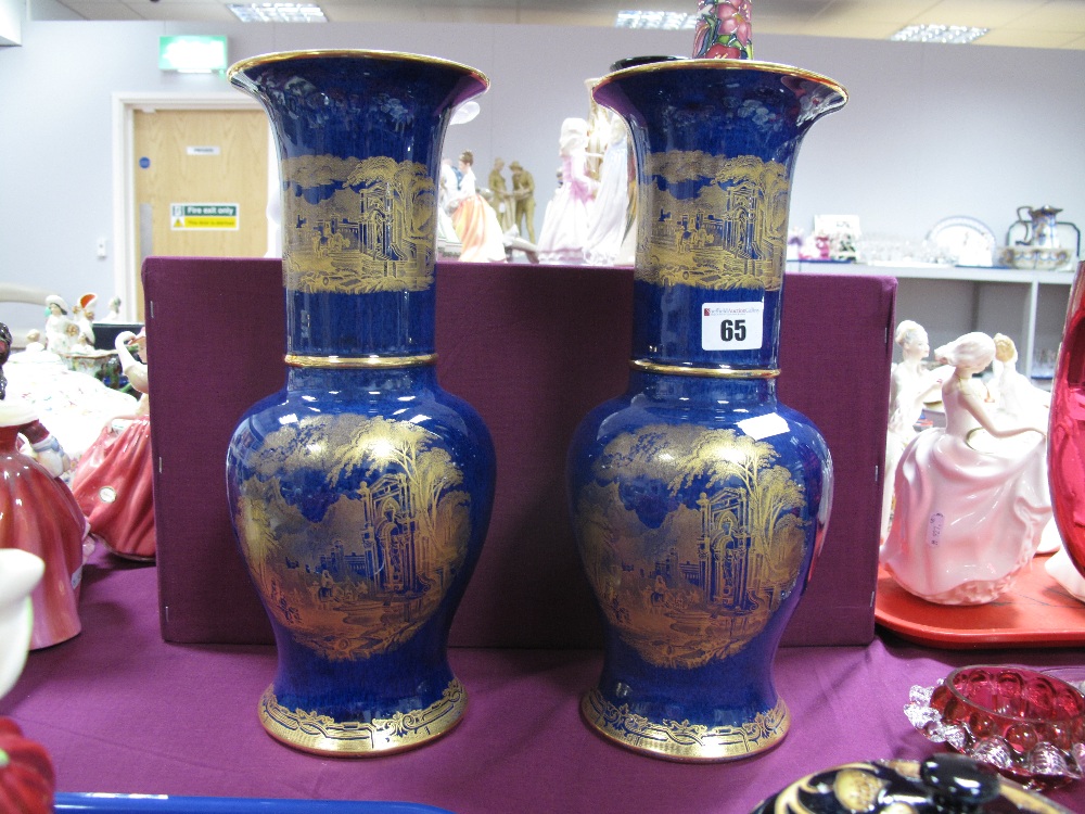 A Pair of Carlton Ware Vases of bulbous form with elongated neck, each with gilt chinoiserie scene