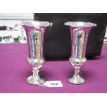 A Pair of Hallmarked Silver Vases, (marks rubbed), each on spreading circular base (bases