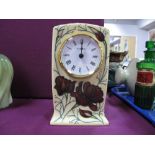 A Moorcroft Pottery Clock, painted in the 'Choclate Cosmos' pattern, designed by Rachel Bishop,
