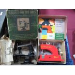 An Early Childs No 20 Singer Sewing Machine, boxed plus a later boxed Vulcan sewing machine.