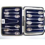 A Set of Six Hallmarked Silver Coffee Spoons, with rat tail detail, together with matching tongs, in