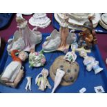 A Pair of Late XIX Century Bisque Porcelain Posy Bowls, as swans and maiden, a figure of a golfer,