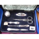 A Hallmarked Silver Mounted Manicure Set, in original fitted case.