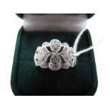 A Modern Platinum Diamond Set Dress Ring, of pierced design, set throughout with brilliant cut