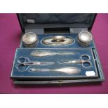 A Hallmarked Silver Mounted Manicure Set, in original fitted case, with associated scissors.