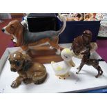 A Rosenthal Dachshund Puppy, a Beswick Bassett Hound, on oval wooden base, Beever, no. 2195, duck