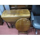 A 1920's Oak Drop Leaf Table, on barley twist and block supports, together with a mahogany folding