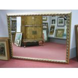 A Large Rectangular Shaped Gilt Wall Mirror, with bevelled glass.