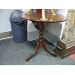 A XIX Century Mahogany Pedestal Table, with a circular top, turned pedestal on shaped legs.