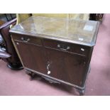 A XX Century Mahogany Cocktail Cabinet, with a glazed top, two small drawers, cupboard doors on