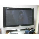 A Panasonic Plasma TV Model No TY-ST42PA50W together with an oak TV cabinet.