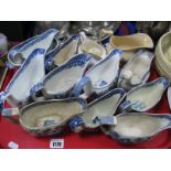 A XIX Century Willow Pattern Gravy Boat, other XIX Century blue and white gravy boats, etc:- One
