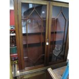 A XIX Century Mahogany Book Cabinet, with knulled carving to pediment and waist, astragal glazed