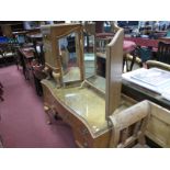 A Walnut Serpentine Shaped Dressing Table, with a low back, central drawer, flanking drawers on