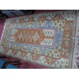 Middle Eastern Tasseled Wool Rug, allover geometric design with centeral orange panel, 218 x 123cm.