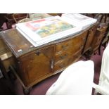 A XX Century Walnut Serpentine Shaped Sideboard, with three central drawers, flanking cupboards,