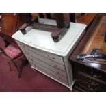 A Cream Bedroom Chest of Five Straight Fronted Drawers, with gilt handles and mounts on squat