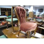 A XIX Century Walnut Spoon Back Nursing Chair, with 'C' scroll top rail, upholsted back and seat