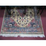 A Middle Eastern Tassled Wool Rug, with pink central lozenge, all over floral decoration on cream