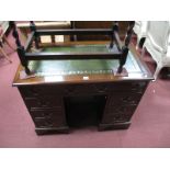 A Mahogany Knee Hole Desk, with a crossbanded top, leather skiver, two top drawers, flanking drawers