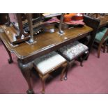 An Early XX Century Walnut Dining Table, on carved cabriole legs, claw and ball feet, (with two