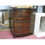 A XX Century Walnut Bow Fronted Chest of Drawers, with a crossbanded top, brushing slide, four